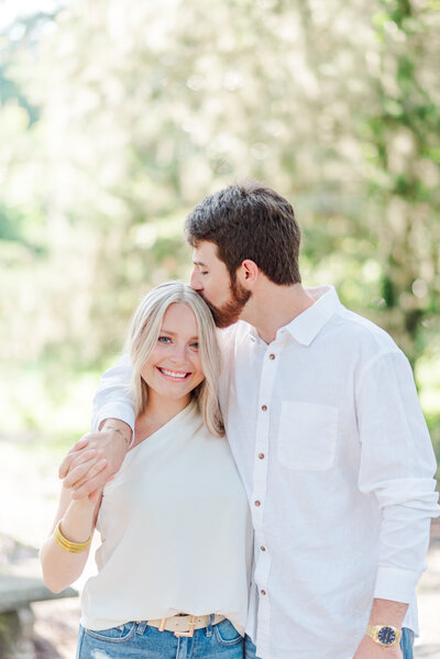 couple smiling at airlie gardens during their engagement phots