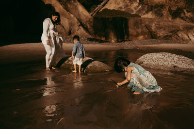 mom and her kids playing at the beach