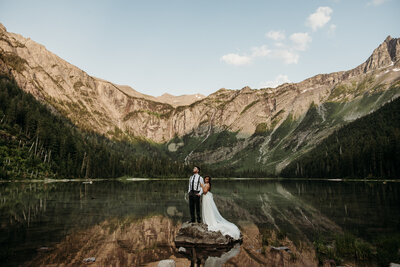 glacie national park elopement surrounded by purple wildflowers and gorgeous mountain views