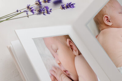 photo album of newborn baby sleeping by york pa photographer