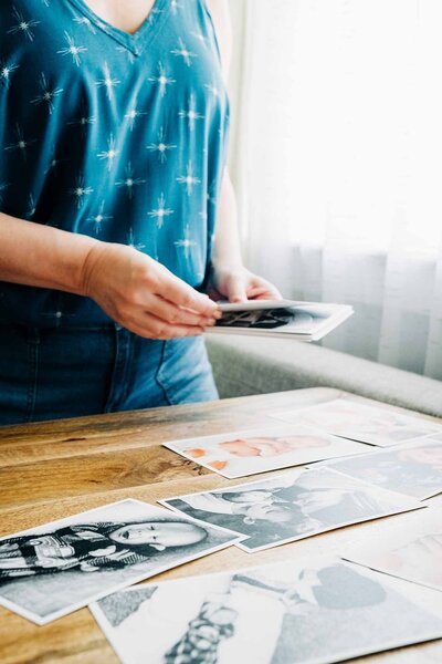 Montana wedding photographer Carin Rene arranging photographic prints