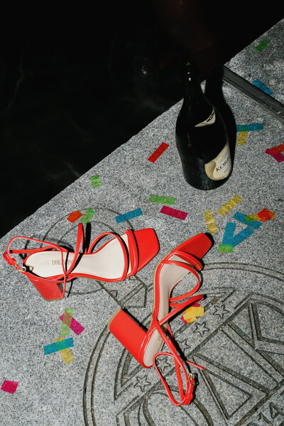Fun detail photos celebrating graduation at the university of Maryland with red heels and confetti