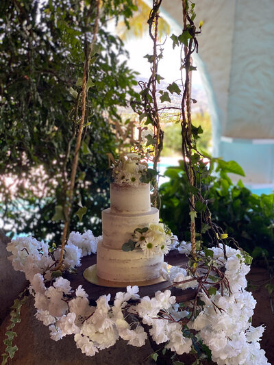 wedding cake with florals on table