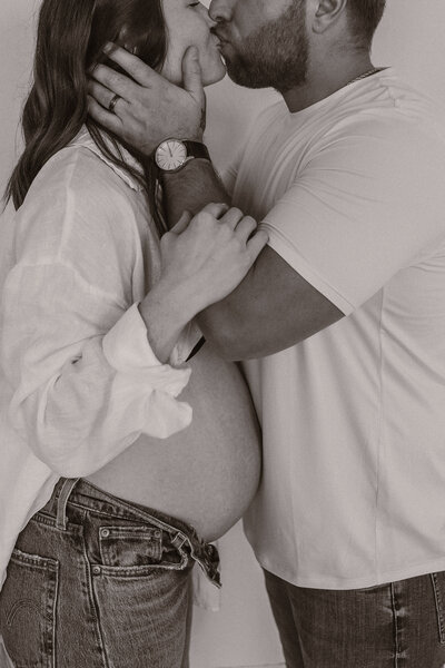 Maternity photo session in Fargo, North Dakota at White House Co. Studio featuring expecting parents.