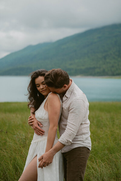 man and woman cuddle together