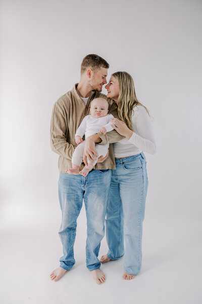 A family photography session in Richmond VA of a couple with their baby.