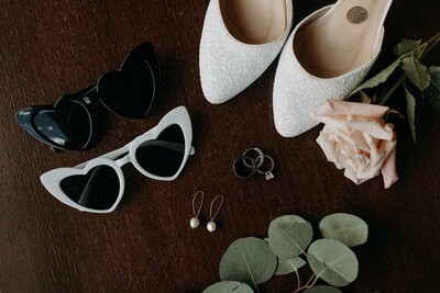sunglasses, earrings, rings and shoes for a wedding