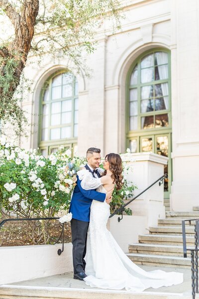 Bride and groom kissing in front of the Ebell of Los Angeles.