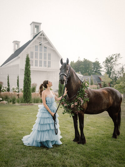 bride-in-blue-dress-with-horse