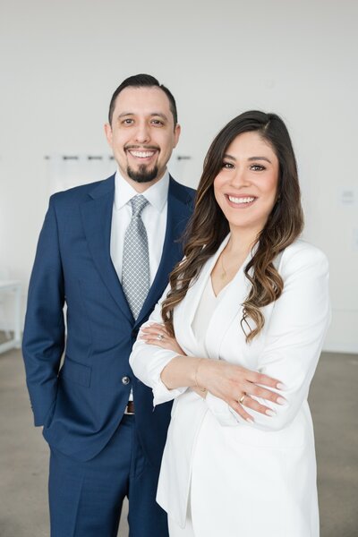 Founders of Romo CPA Tax + Advisory, trusted CPA for entrepreneurs in Dallas, TX, pictured in their office wearing elegant, professional outfits and bringing years of expertise.