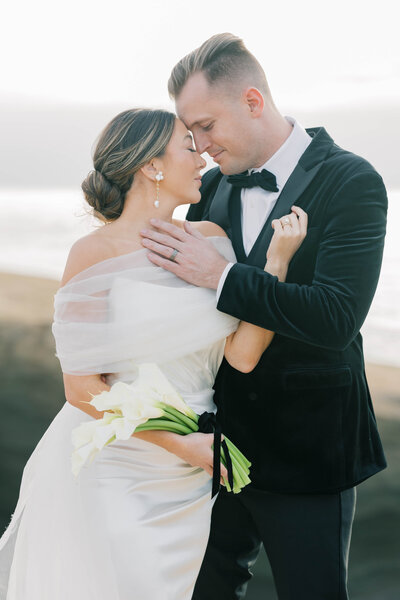Charleston Wedding | Couple embracing on wedding day at ocean