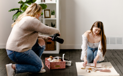 Woman taking photo for wedding stationery business