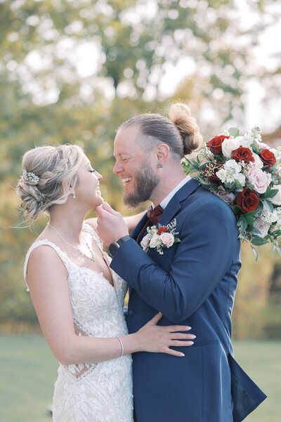 Bride and groom looking at each other while sitting at Pleasant Hill Home