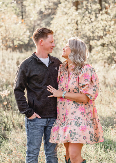 Couple hugging and posing for engagement photos