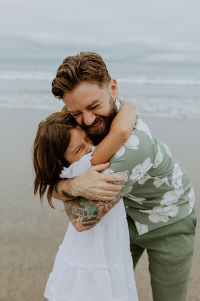 Beach candid natural fun family photo shoot with kids, christmas holiday card photo shoot, San Diego portraits photographer, young families