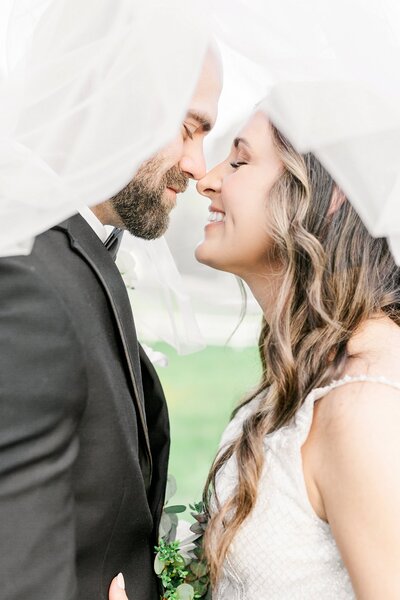 Bride and Groom under veil by Amanda Horne Photography | Columbus GA Wedding Photographer