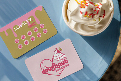 The Doughnut Experience boutique doughnut bakery branding by Wildspark Creative. Custom logo, packaging, and brand identity created for female founders, delivering feminine, premium, and retail-ready design for Michigan’s gourmet baked goods market.

Female-led Michigan bakery branding for The Doughnut Experience. Wildspark Creative crafted a boutique logo, packaging, and brand identity that highlights gourmet doughnuts, feminine aesthetics, and retail-ready packaging for strong shelf and social impact.