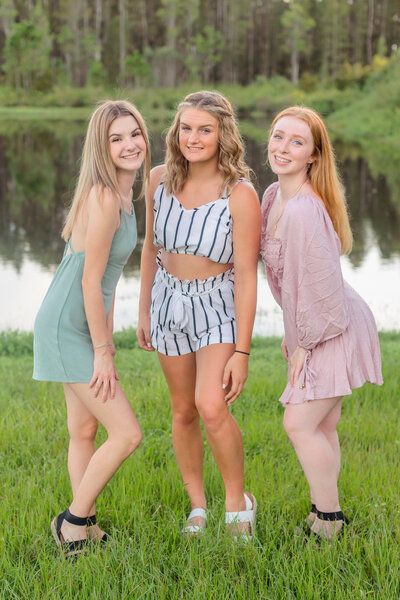 Three girls in prom dresses
