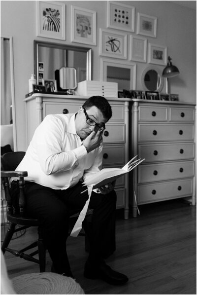 Emotional groom reading letter