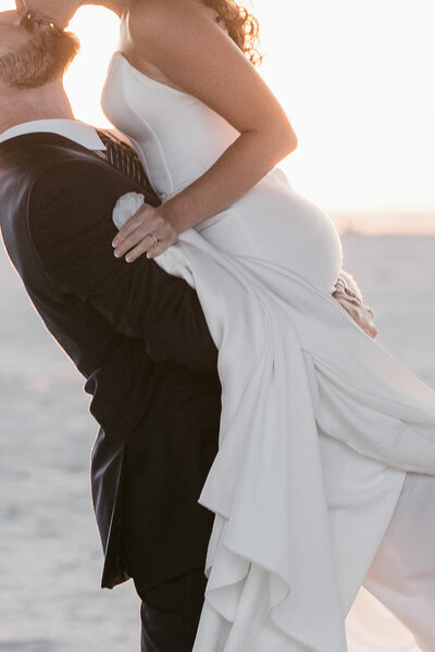 A behind the scenes image of award winning wedding photographer, Zack Bradley as he photographs a couple on the steps of the Detroit Institute of Art