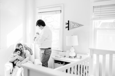 family of four in nursery