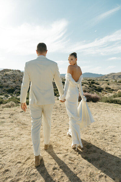 bride and groom walking in the distance