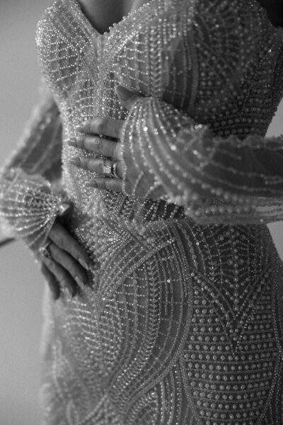Bridal details of a bead embroidered wedding dress as bride gets ready for her wedding day at Rosewood Mayakoba in Mexico, captured by Andrea-Marie Photography