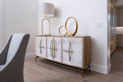 Enhance your dining room decor with our exquisite white sideboards and buffets, finished with glamorous gold metallic touches.