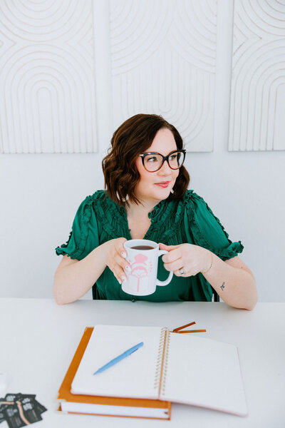 Copywriter for photographers Sara Gillis typing on her laptop