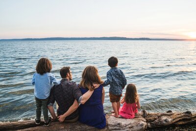 Family looking at Puget Sound during West Seattle family photo session