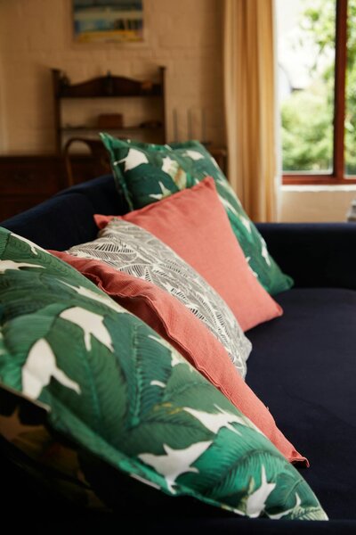 green and coral throw pillows for a comfy, cozy life