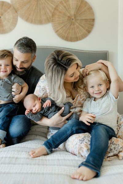 lodi california newborn session with family on bed