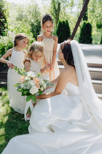 Brides walking along path after outside wedding in Finger Lakes, NY