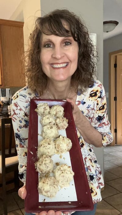 Penny holding up a plate of healthy cookies