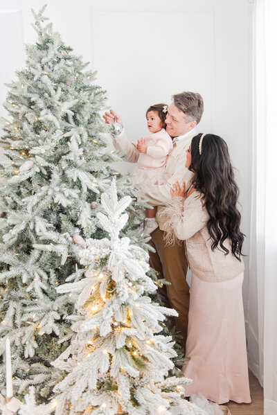 engaged couple in front of the Christmas Tree by Miami Christmas Mini Session Photographer MSP