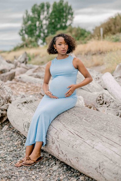 couple poses for their maternity session in seattle