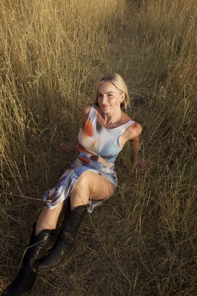Jaiden sitting on chair holding a telephone