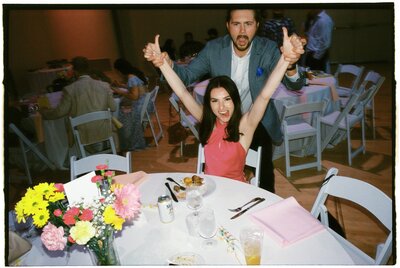 wedding-guests-celebrating-film-photograph-flash