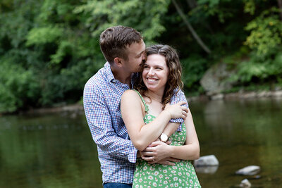 couple laughing in nature near Wissahickon Creek Philadelphia