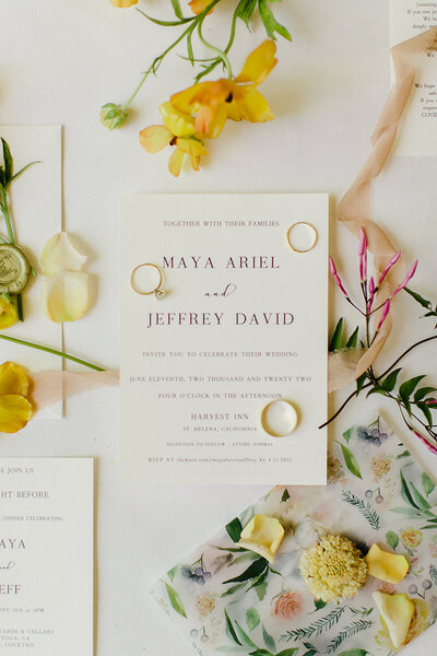 A wedding invitation flat lay for St. Helena wedding.