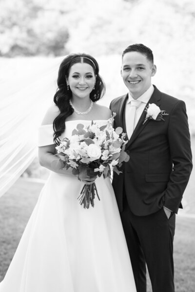 An Austin-based wedding photographer captures a classic black and white photo of a bride and groom posing.