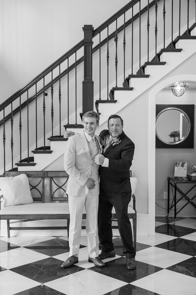 A groom and his dad joking around during the formal family photos at Hazlenut farms in louisville, Kentucky