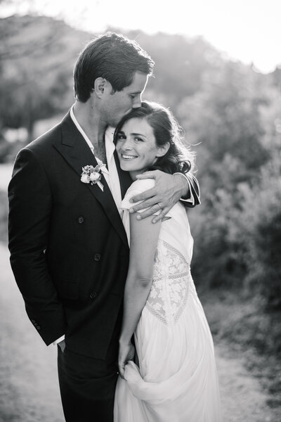 happy bride in groom in garden of bastide de marie