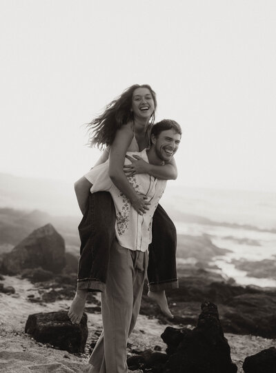 destination elopement photography  in hawaii bride and groom laughing eloping on the beach