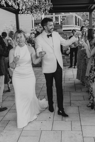 couple holding hands atop Mont Tremblant, Quebec