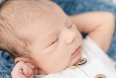 Newborn baby girl with white headband