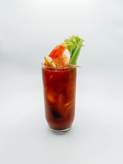 Bloody Mary Cold Brew from Quigley Coffee Co, an iced cold brew coffee with tomato, spices, celery, and fresh garnish.
