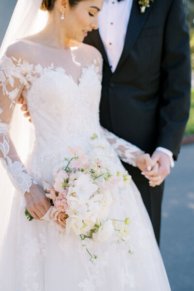 A couple enjoys their wedding flowers in New England.