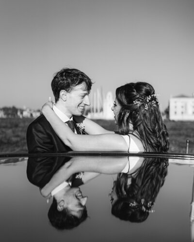 Bride and groom on boat on Venice canal