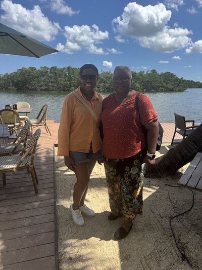 Career coach for professional women having lunch with mom at beach